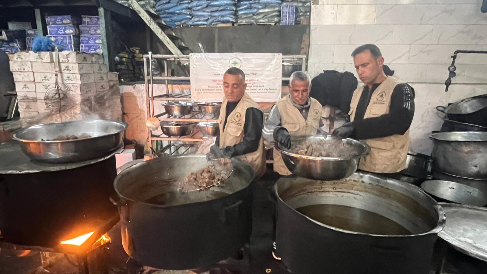 Meat ladled out for the meal trays